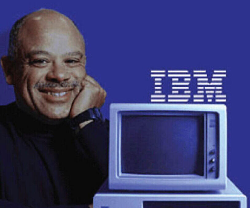 Mark Dean next to an early IBM personal computer